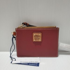 Dooney and Bourke pebble leather zip top card wristlet.